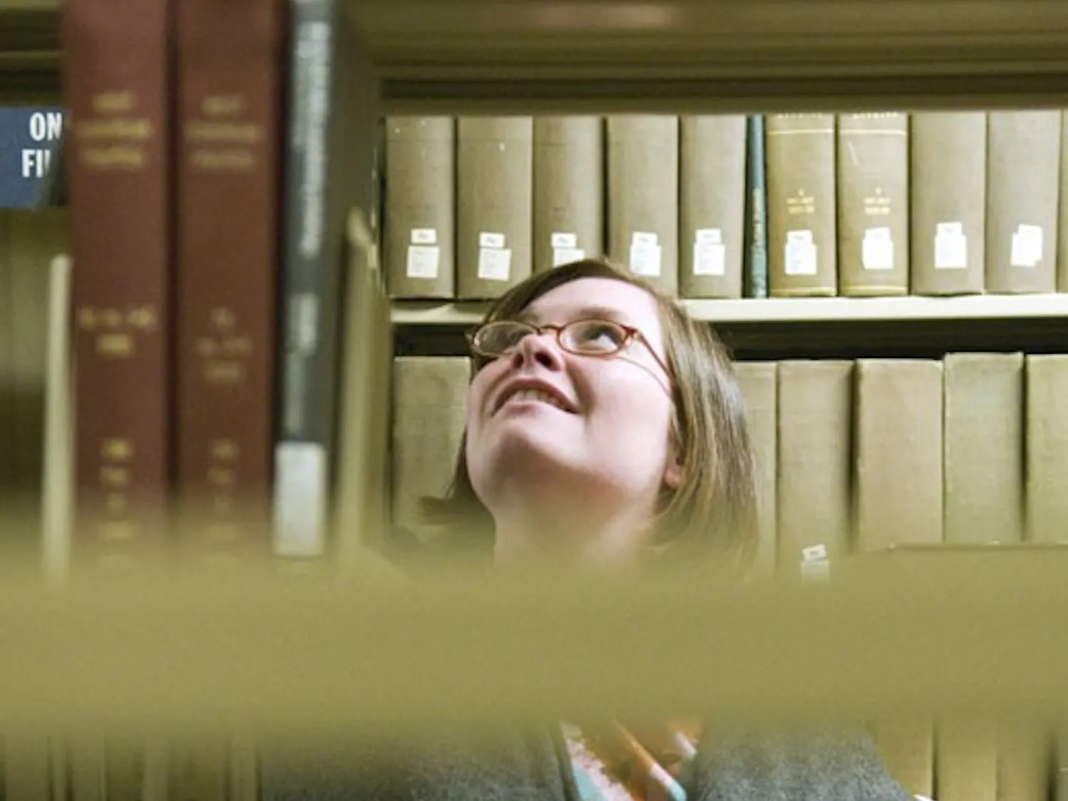 Megan Beard files books in Zimmerman Library's basement Tuesday.