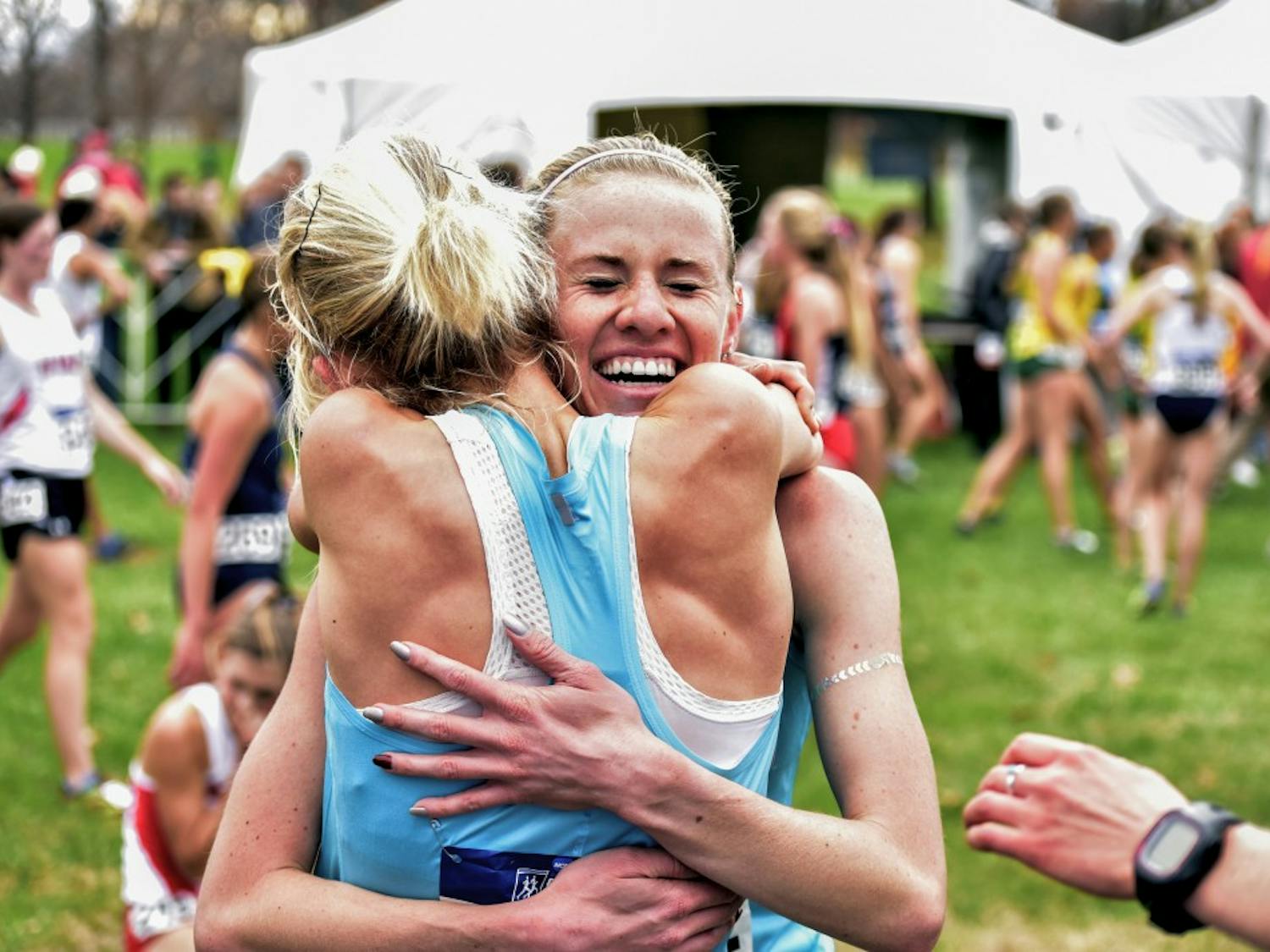 Senior Courtney Frerichs is embraced by one of her teammates after crossing the finish line at the NCAA Division I Cross Country Championships on Saturday, Nov. 21 in Louisville, KY. Frerichs was the first Lobo to cross the finish line, coming in 4th place to help UNM win its second ever national title.