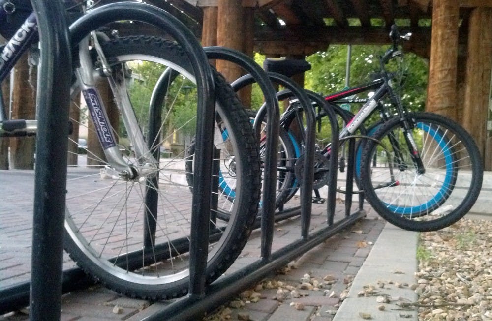 	A row of bicycles sit parked at a bike rack on campus Tuesday evening. The UNM Police Department reported a 70 percent increase in bicycle thefts 2013-14 school year compared to the previous year.