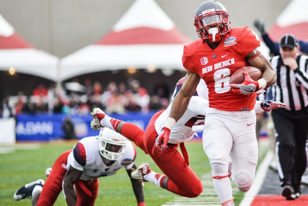 UNM’s Jhurell Pressley evades  Arizona University defensemen during the 10th Gildan New Mexico Bowl Saturday December 19, 2016 at University Stadium. Pressley will try his chances in becoming a free agent for the Minnesota Vikings.