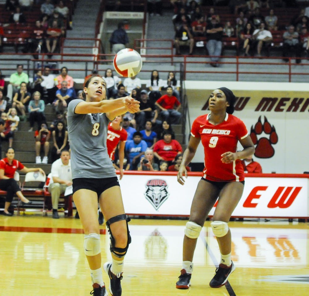UNMs Ashley Kelsey hits the ball during UNMs match against UC Irvine on Nov. 13, 2014. UNM currently has three slots open for outside hitter candidates. 
