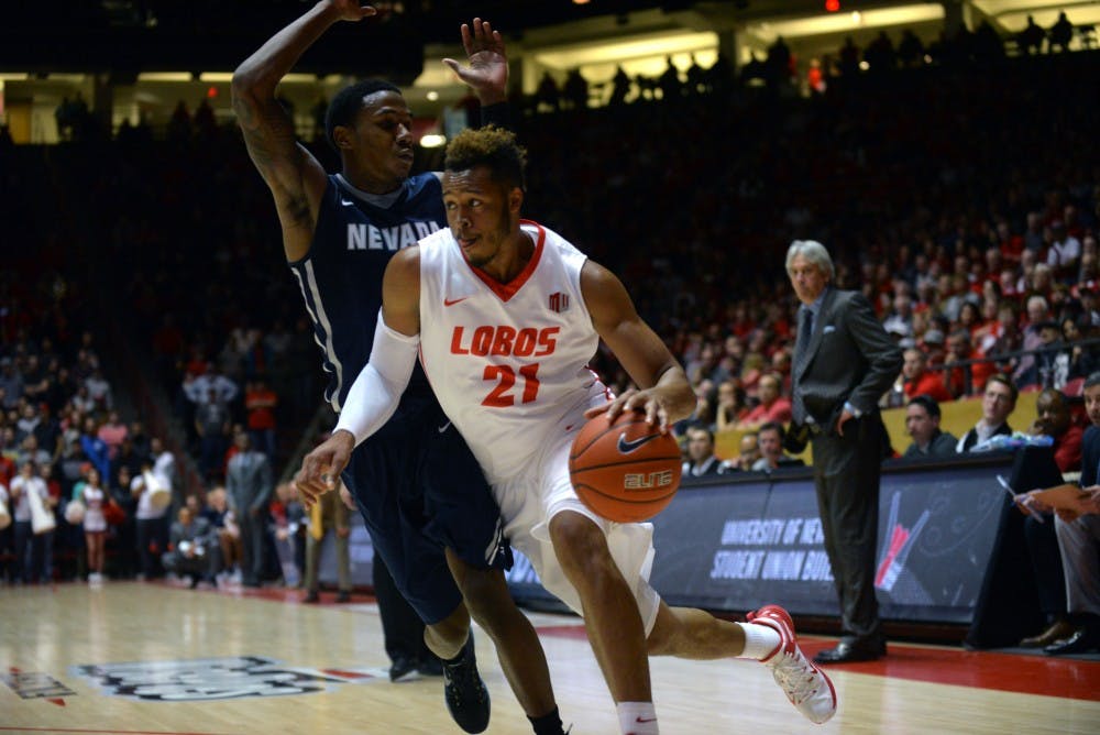 Sophomore guard Xavier Adams drives to the net at WisePies Arena Wednesday, Dec. 30. UNM improved to 2-0 following Saturday's win over Fresno State.