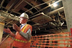 Harvey Chace, associate director of the Physical Plant for maintenance and planning, talks to the media during a  news conference on May 12 in Zimmerman Library regarding the April 30 fire.