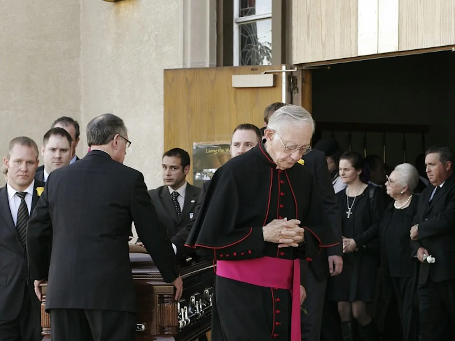 Monsignor Francis X. Eggert leads the procession carrying Justice Gene Franchini’s casket at Our Lady of Fatima Catholic Church on Saturday. Franchini died Wednesday evening while giving a speech to first-year law students on north campus. Over 500 people attended Franchini’s funeral, including Board of Regents President Raymond Sanchez, a long-time friend.