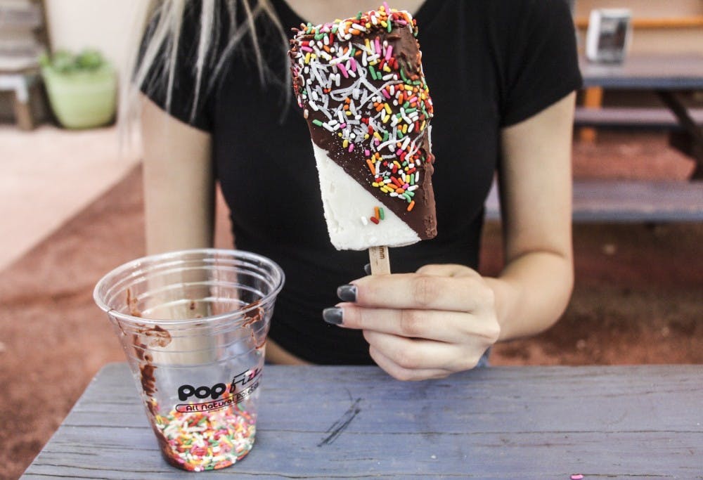 Ilen Molina sits outside of Pop Fizz enjoying one of the pallets offered on Aug. 25, 2018.&nbsp;