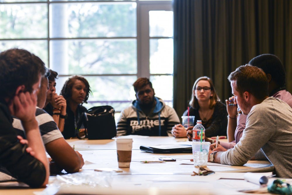 Students discuss safety issues and potential solutions Tuesday evening in a SUB ballroom. The event was organized by LoboRESPECT to address concerns raised at ASUNM’s recent Safety Day.
