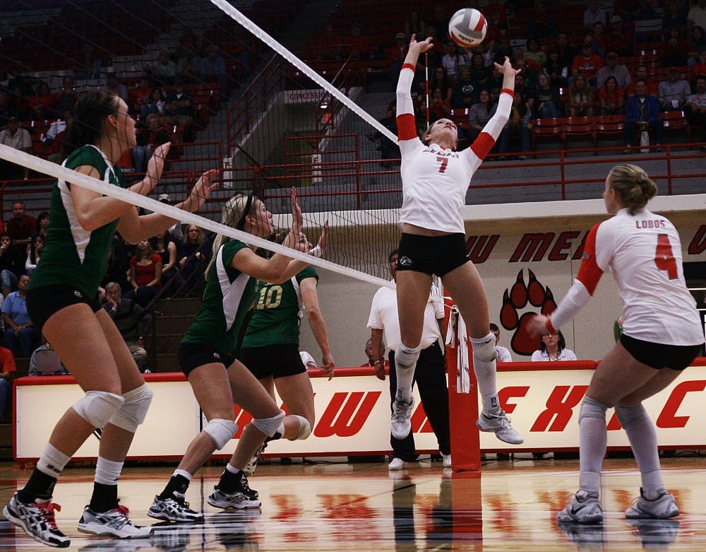	Jade Michaelsen sets up Lobo teammate Ashley Rhoades during UNM’s 3-2 loss to Colorado State on Saturday at Johnson Gym. The Lobos are 14-8 overall and 5-5 in the Mountain West Conference.