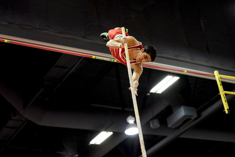 A UNM pole vaulter pushes himself over the bar during the New Mexico Team Invitational on Saturday, Jan. 28. 2017 at the Albuquerque Convention Center.&nbsp;