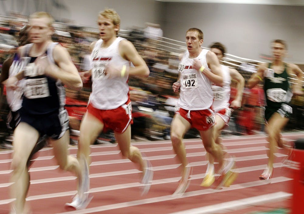 	Lee Emanuel, center, drifts during the 3,000-meter run at the Albuquerque Convention Center on Saturday. Emanuel dropped out of the 3,000-meter midway through. Emanuel won two events, including the mile run, and looks to defend his NCAA championship in two weeks at the NCAA Preliminary Round.