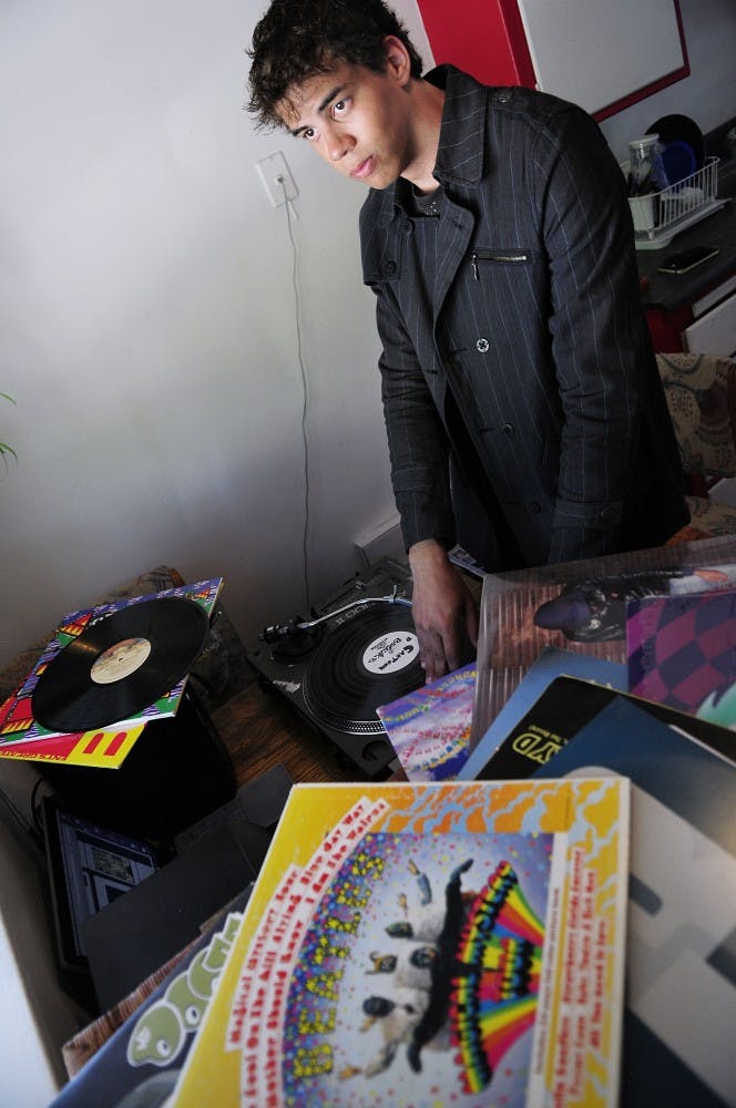 	Nathan Jackson, founder of the music blog Chemical Jump, revels amid his music collection. Jackson said the name “Chemical Jump” came from randomly combining words together until something good emerged.