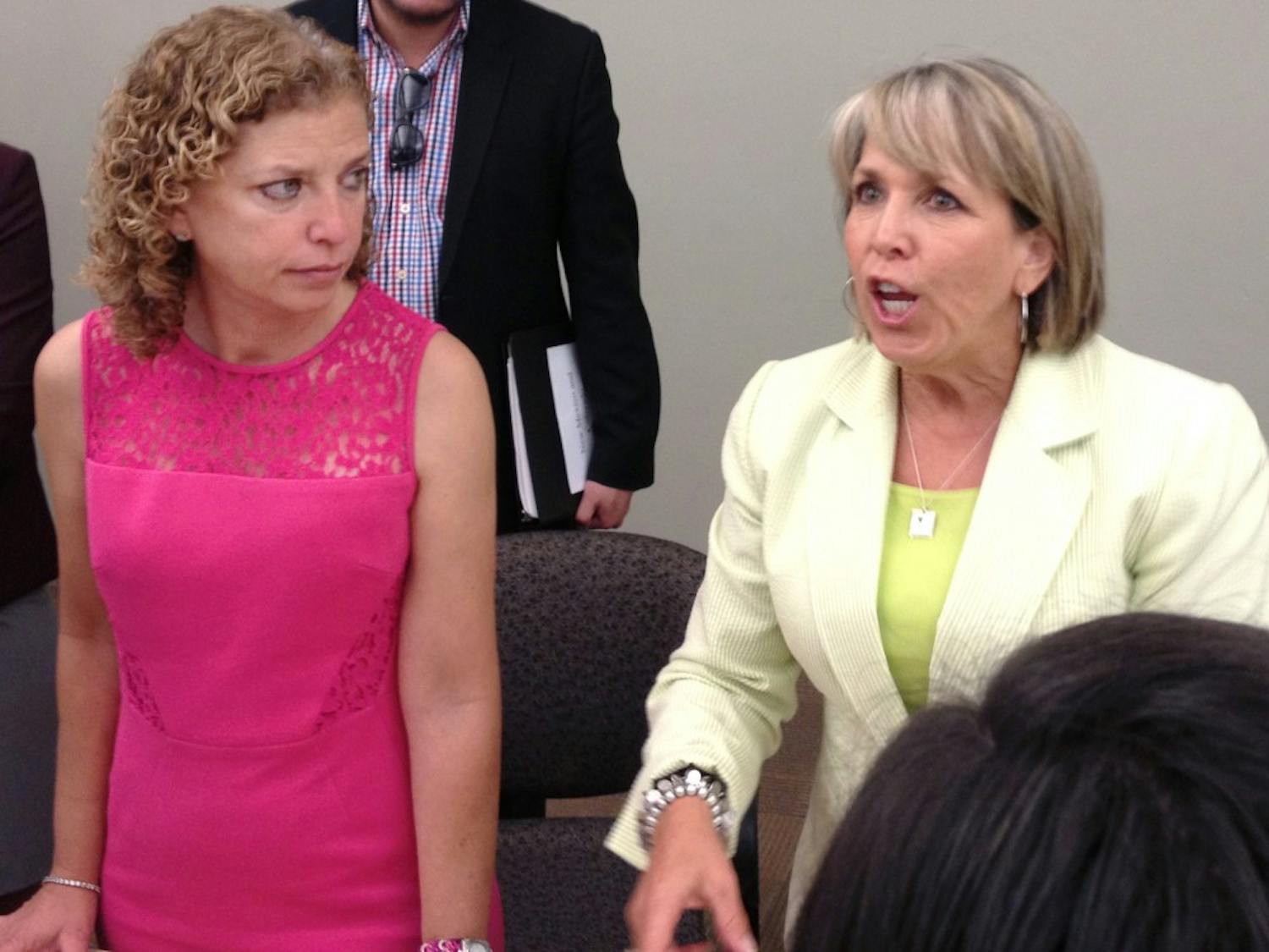 	Rep. Debbie Wasserman Schultz, left, and Rep. Michelle Lujan Grisham speak in the SUB on Sunday. The Democratic Party of New Mexico and the Young Democrats of New Mexico held a roundtable discussion to speak about issues such as women’s health, equal pay, and the 2014 election.