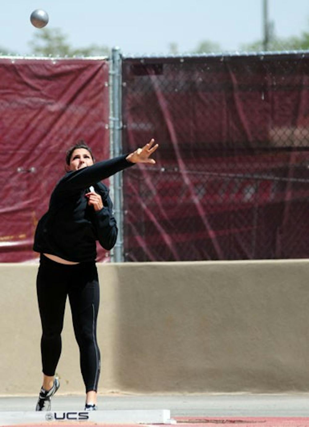 Sandy Fortner warms up on the shotput during Thursday's practice at the UNM Track Complex. The Lobos are hosting the Don Kirby Invitational on Saturday. 