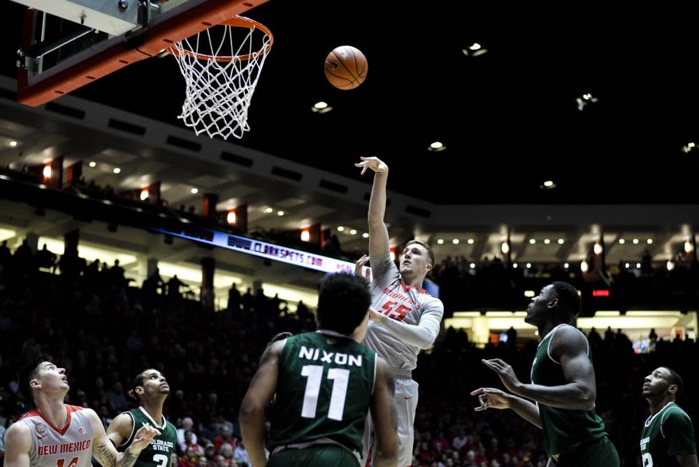 Redshirt Sophomore Connor MacDougall towers over Colorado State players as he shoots an inside jump shot Feb. 21, 2017 at WisePies Arena.