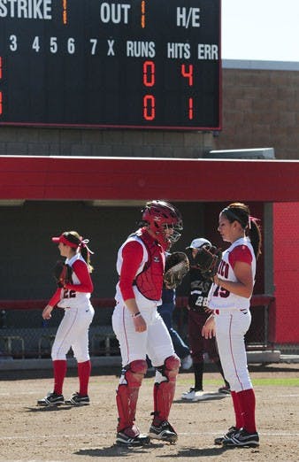 UNM catcher Erin Brandow and pitcher Danielle Castro talk on the mound during Saturday's game. The Lobos blew a three-game series to Texas State over the weekend and fell to 9-23 on the season.