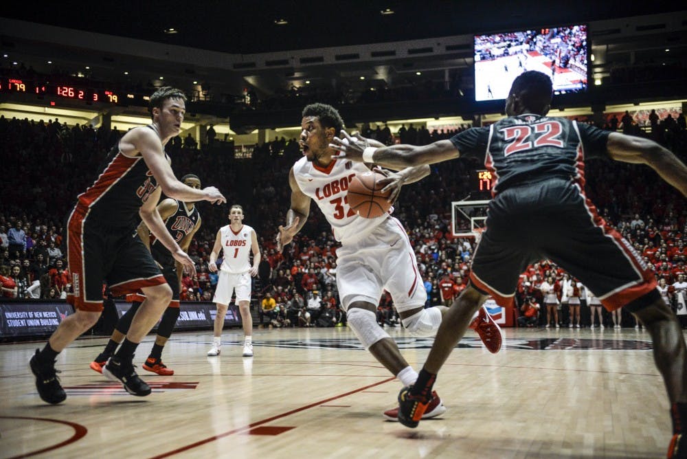 Jr. Anthony Mathis protects the ball against University of Nevada, Las Vegas on February 02, 2016 at the Dreamstyle Arena. 