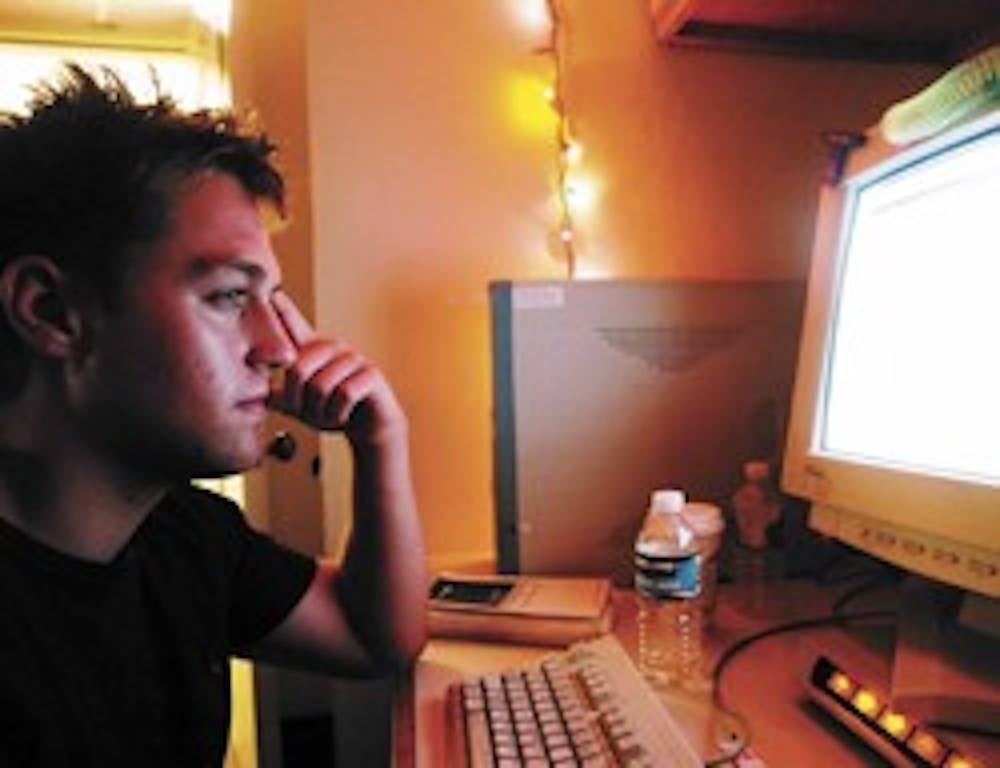 Sports editor Riley Bauling works in the production room of the Daily Lobo on Tuesday. Bauling will become editor in chief of the student paper Monday.