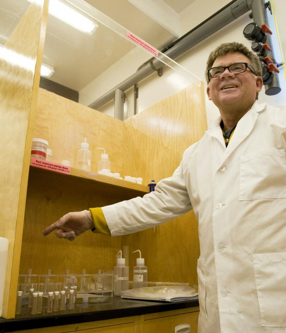 	Victor Polyak shows “separation wells,” which separate uranium isotopes, in a laboratory at Northrop Hall on Tuesday. Polyak and his colleague, Yemane Asmerom, are examining stalagmites thousands of years old to catalog climatic shifts through time.