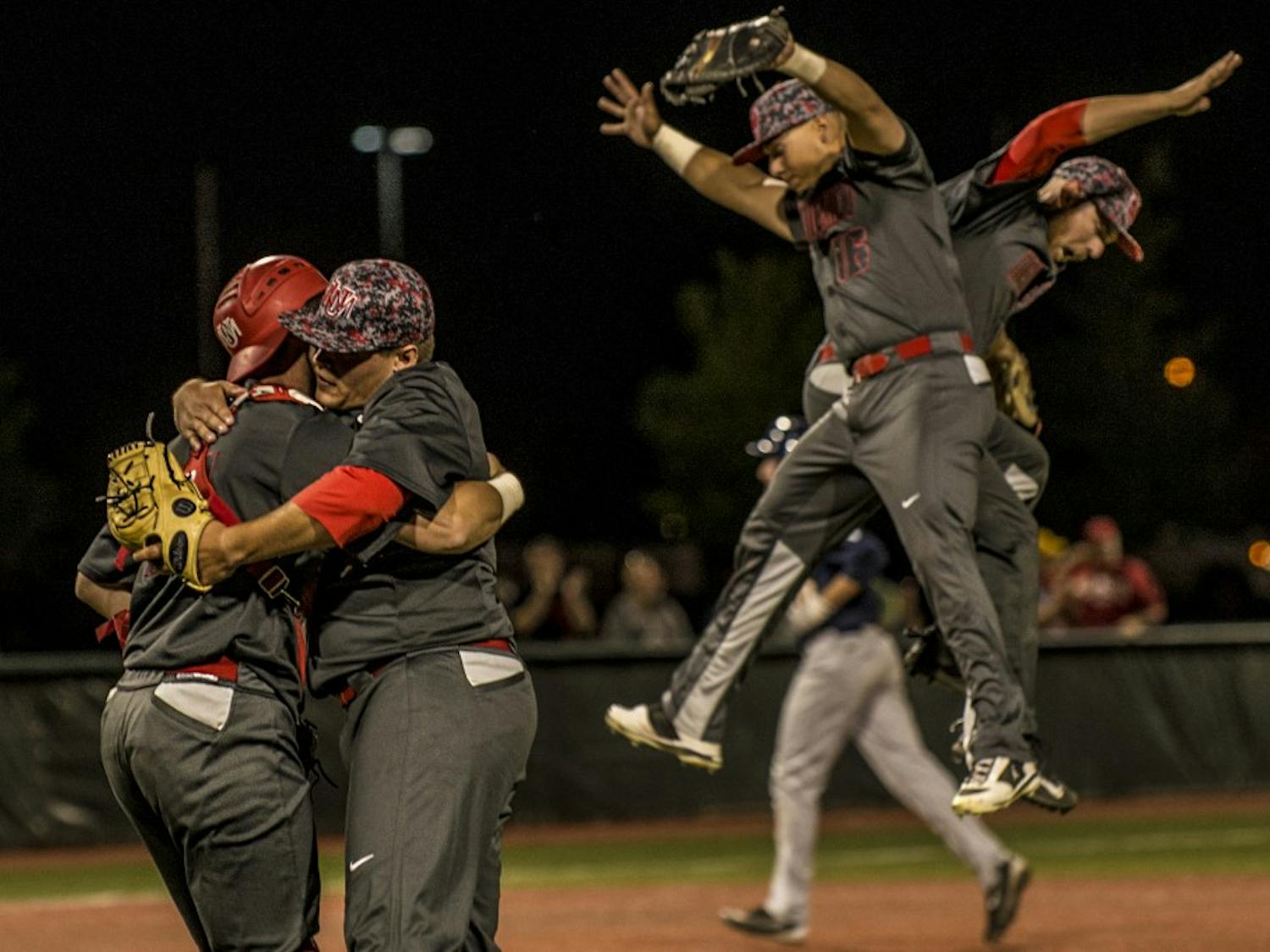 Lobo pitcher Tyler Stevens embraces Andrew Pratt, catcher, after pitching a complete game during the opening Mountain West Championship game Thursday night at the Santa Ana Star Field. The 7-2 victory against Nevada advances the No. 1 seated Lobos to the next round against No. 2 San Diego State, Friday night @ 7 p.m.