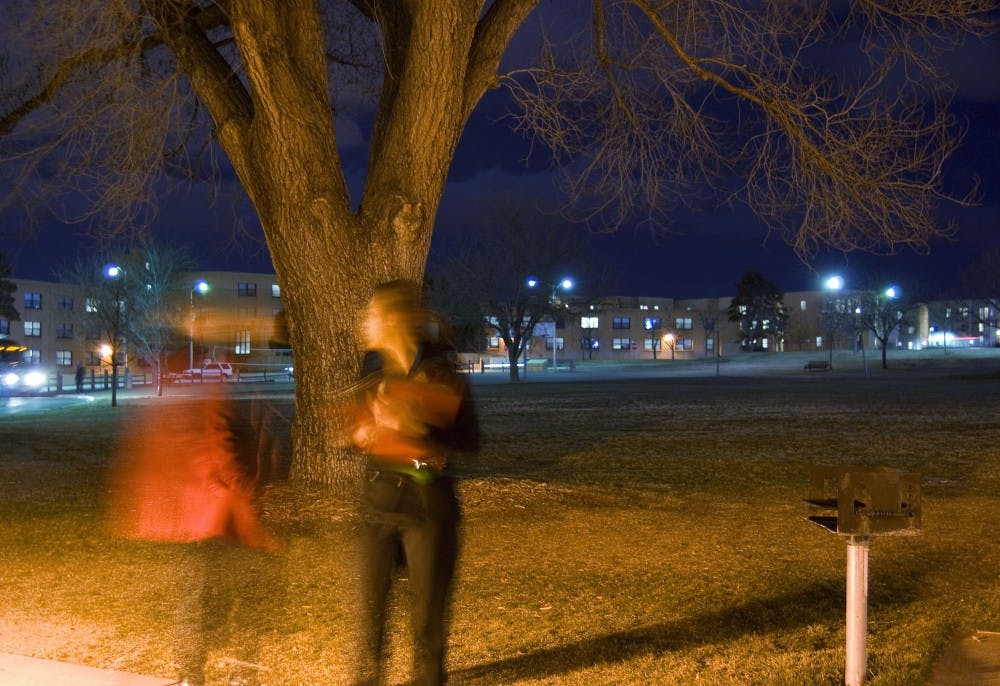 	Corine Gonzales, left, and Tullivan Begay inspect lower Johnson Field during a campus safety walk Thursday. The Office of Student Affairs organized about 70 students, staff and faculty to break off into small groups and look for possible safety hazards in light of the Feb. 15 student stabbing near the anthropology building. 