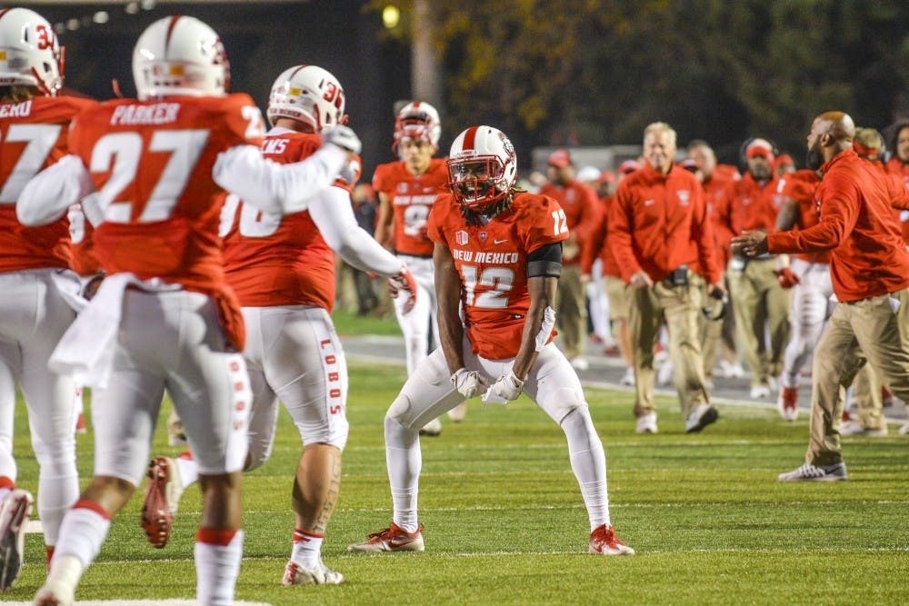 Redshirt senior safety Ryan Santos screams while celebrating with teammates after a Lobo touchdown on Saturday, Nov. 26, 2016 at University Stadium. The Lobos ended regular season play with a 56-35 victory over Wyoming.