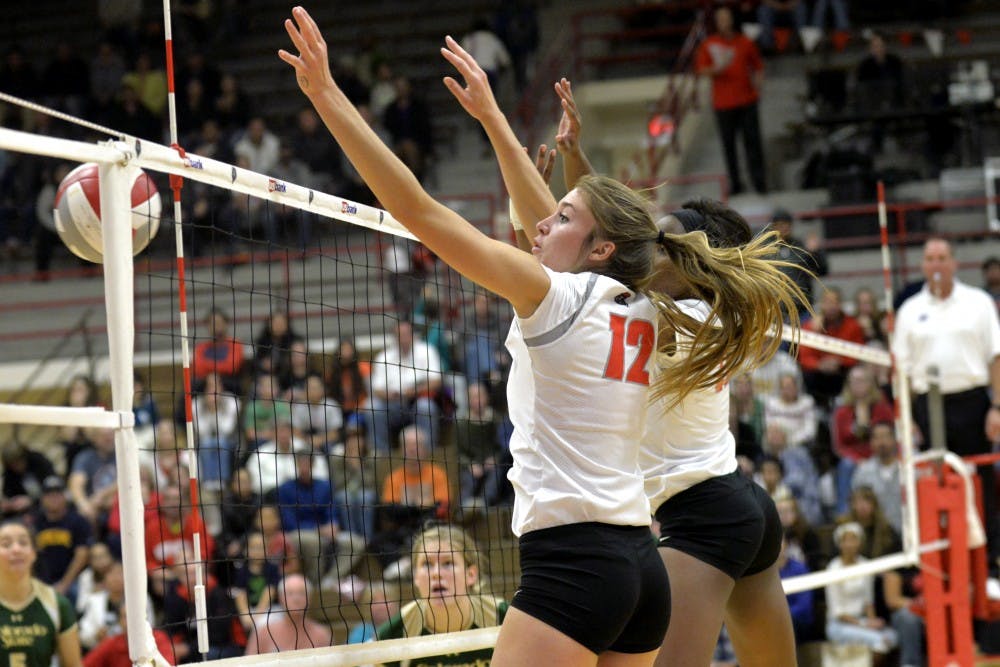 Lobos Cassie House (left) and Skye Gullatt block a CSU kill at Johnson Center on Nov. 7. The Lobos play UNLV this Thursday in Las Vegas, Nevada.