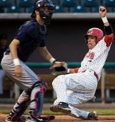 Shortstop Scott Gracey scores in the fifth inning of Tuesday's 10-6 loss against Arizona at Isotopes Park. Arizona went on to win Wednesday's game 4-2. 