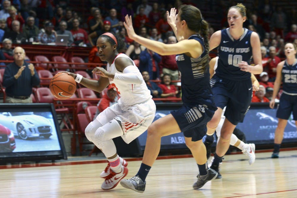Senior guard Bryce Owens works the ball inside against a Utah State player Wednesday, Feb. 10, 2016 at WisePies Arena. The Lobos beat Boise State 70-60.