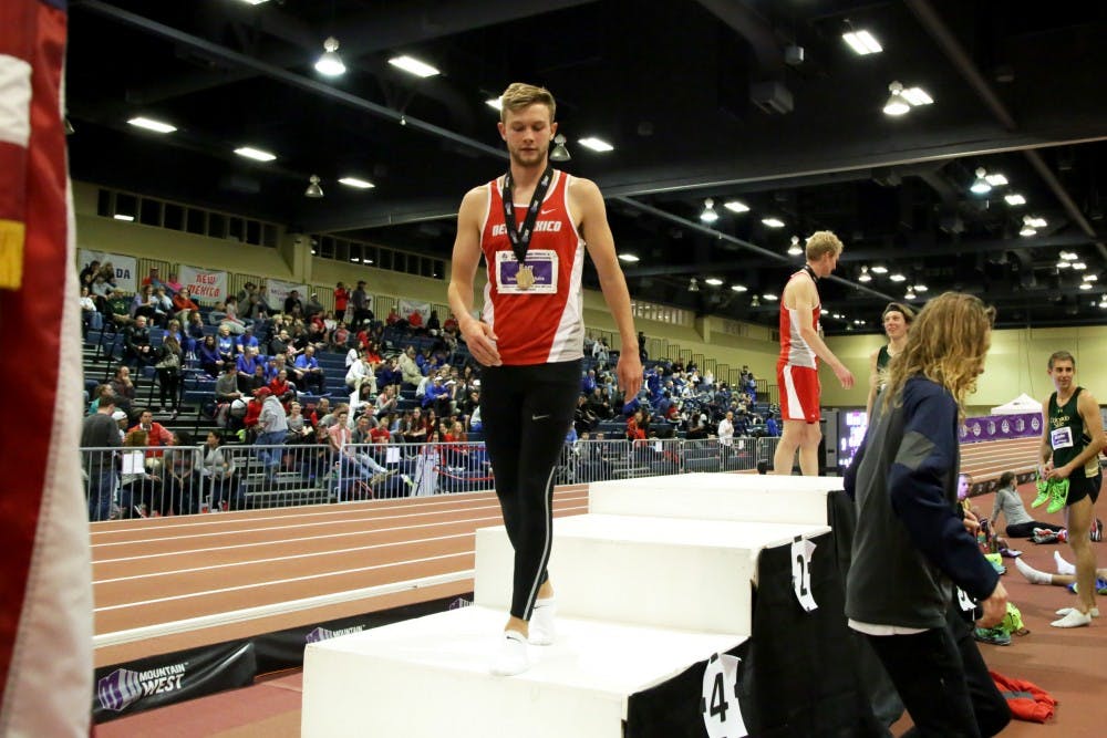 Sophomore distance runner Josh Kerr walks off the podium after coming in first for the mens mile at the Mountain West Track and Field Championship. Kerr was named national athlete of the week due to his most recent 1500 meter time being the nest in the world.