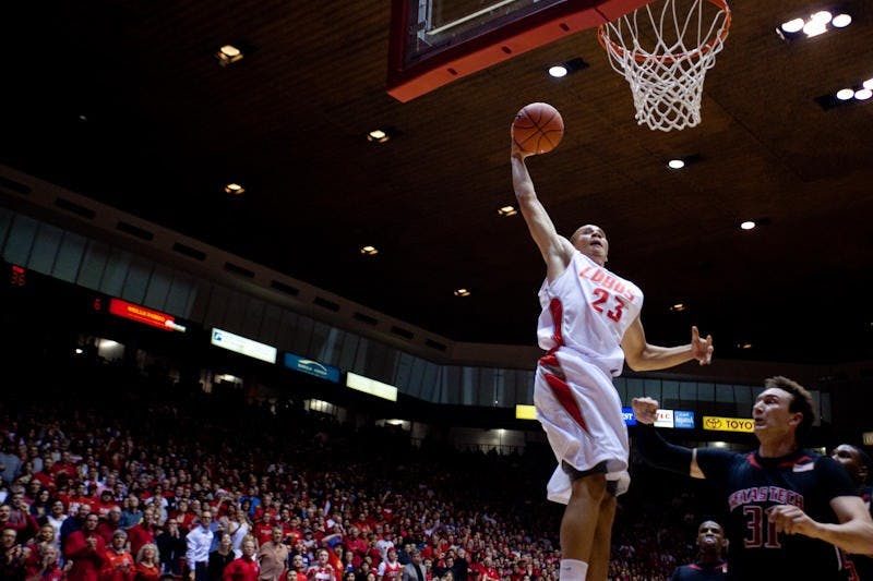 	Guard Phillip McDonald skies past Darko Cohadarevic during Tuesday’s
game against Texas Tech at The Pit. The Lobos defeated the Red Raiders
90-75 and are 13-1 overall.