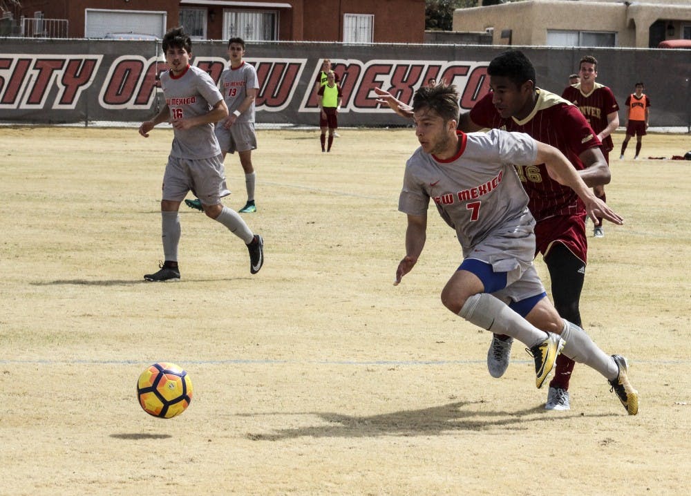 UNM's Grayson Dupont darts down the field in a game against Denver on March 31 at UNM's Soccer Complex.