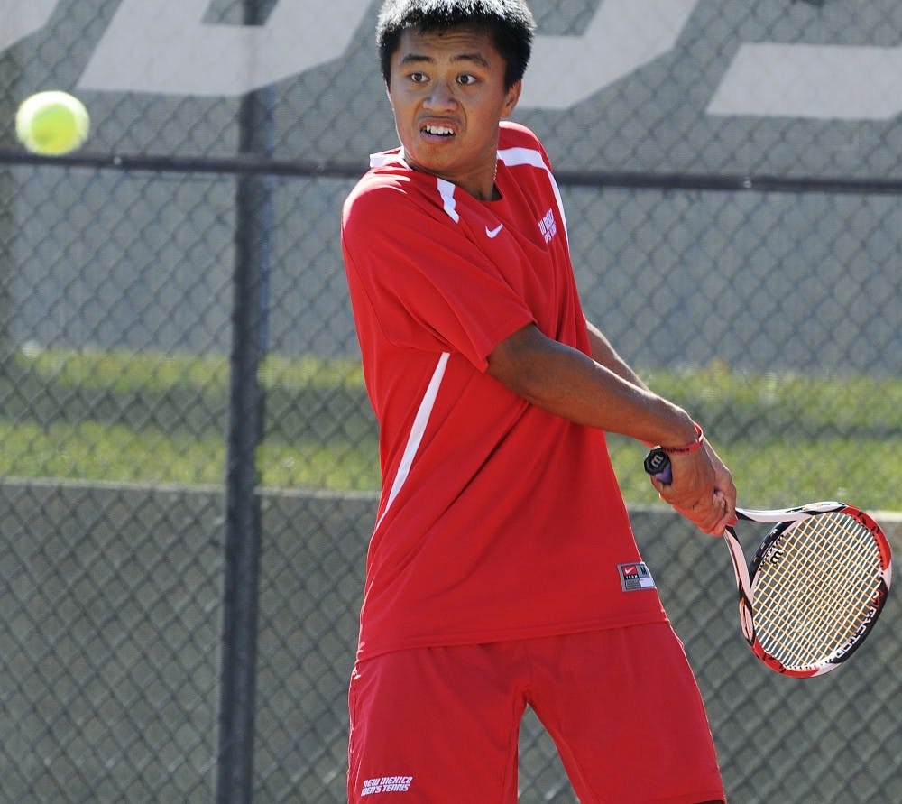 	Carl Ho rears up to return the ball during Sunday’s Balloon Fiesta Invite. Ho went 4-0 over the weekend and won the individual title.