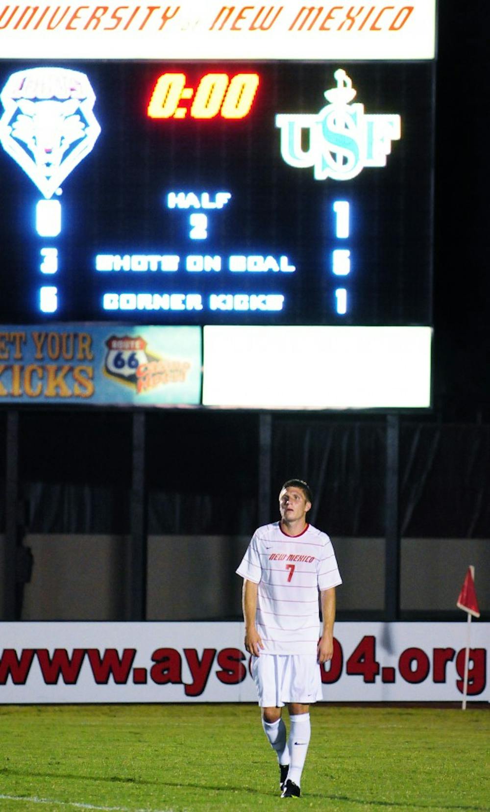 	Forward Justin Davis walks off the field after the Dons upended the Lobos Saturday at the UNM Soccer Complex.