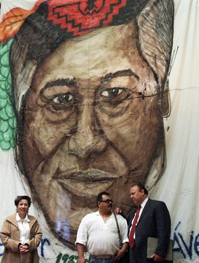 Vice President of Student Affairs Cheo Torres, right, talks with Frederico Reade during a celebration for Cesar Chavez's birthday at the SUB on Monday. Torres was given the Cesar Chavez Si Se Puede award Saturday for his involvement in the community.