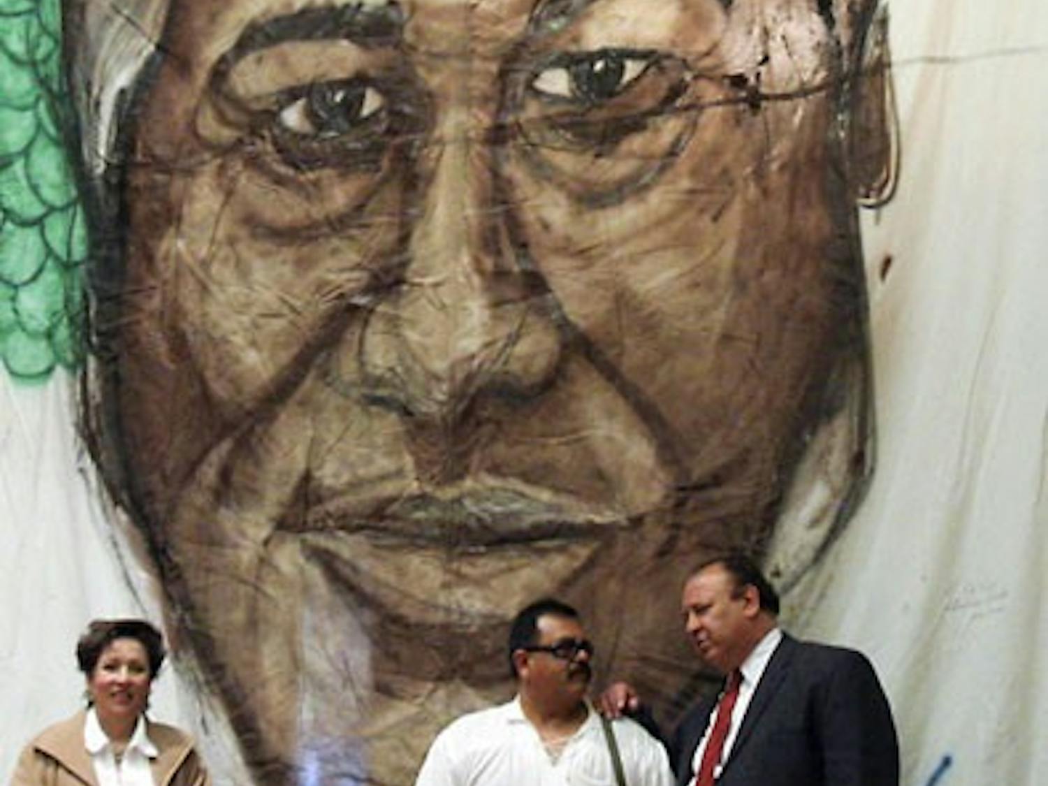 Vice President of Student Affairs Cheo Torres, right, talks with Frederico Reade during a celebration for Cesar Chavez's birthday at the SUB on Monday. Torres was given the Cesar Chavez Si Se Puede award Saturday for his involvement in the community.