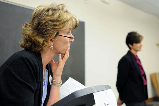 District Attorney Kari Brandenburg debates Lisa Torraco, who is running against her in the upcoming election, at the UNM School of Law on Thursday. 