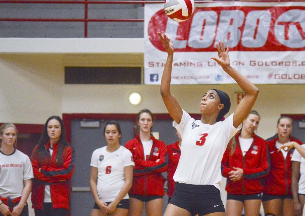 Lobo redshirt senior right side Chantale Riddle serves the ball during their game against Utah State at Johnson Gym on Thursday, Oct. 2. Riddle was named National Player of the Week.