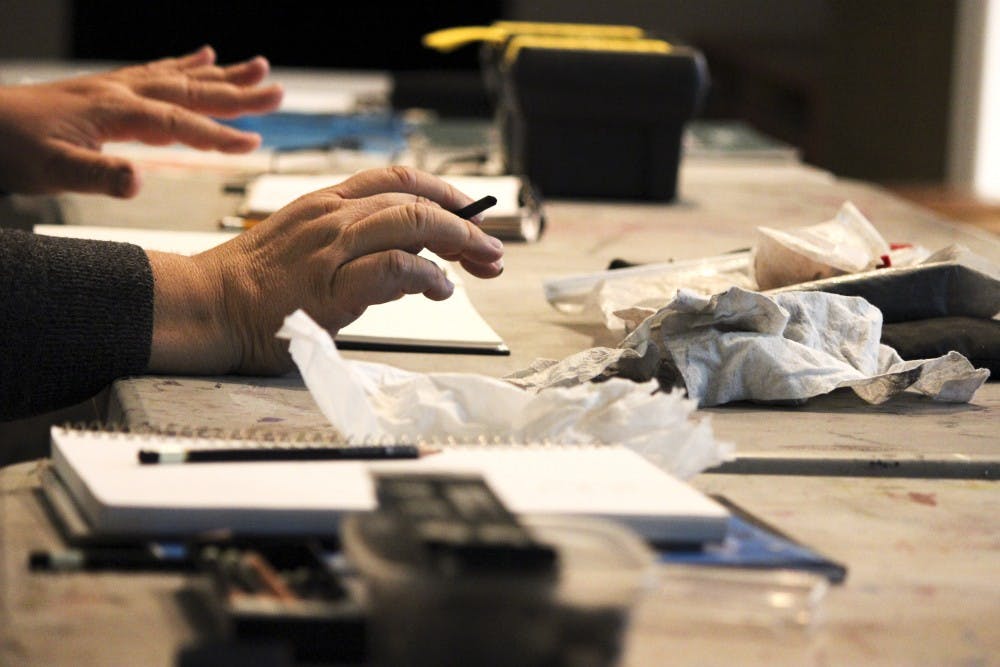 Artists gather at the Harwood Art Center to sketch live models and interact with other artists on Tuesday night. The Harwood Art Center hosts weekly open-drawing sessions with a live nude model as part of its adult art courses, promoting artistic learning through in-person observation of the human body.
