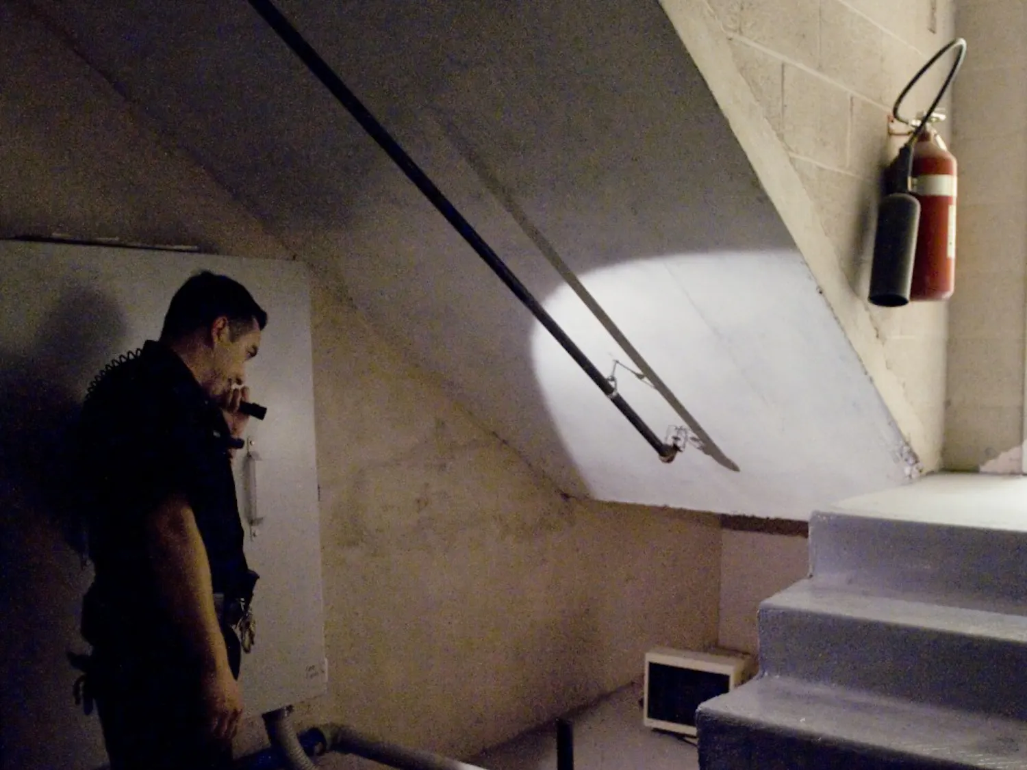 UNM Police Department officer Chris Carabajal checks a nook near Theater X in the Center for the Performing Arts. Carabajal said he monitors this area after finding a homeless man in a previous occasion