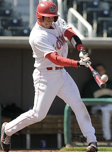 UNM catcher Rafael Neda connects with a pitch during Saturday's first game of a doubleheader, a 9-4 win over Vermont. The Lobos swept Vermont in a four-game series at Isotopes Park this weekend. 