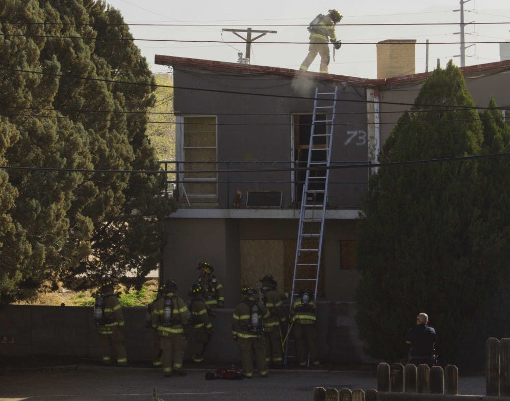 Albuquerque Fire Department firefighters respond to a fire at Lambda Chi Alpha, a closed fraternity on 1805 Sigma Chi Road, on Wednesday morning. The department received a call at 9:33 a.m. saying that smoke was going out of a window of a house, according to an Albuquerque Police Department officer on-scene. The fire was contained in one room and no injuries were reported. The cause is currently under investigation. The street between University Boulevard and Yale Boulevard remained closed until 11 a.m. 