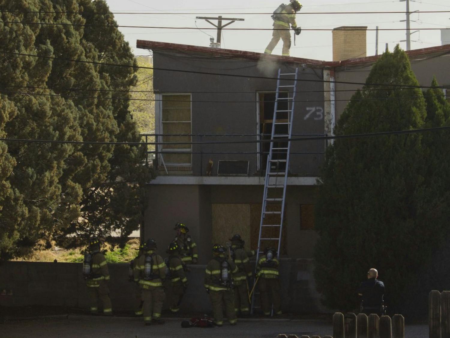 Albuquerque Fire Department firefighters respond to a fire at Lambda Chi Alpha, a closed fraternity on 1805 Sigma Chi Road, on Wednesday morning. The department received a call at 9:33 a.m. saying that smoke was going out of a window of a house, according to an Albuquerque Police Department officer on-scene. The fire was contained in one room and no injuries were reported. The cause is currently under investigation. The street between University Boulevard and Yale Boulevard remained closed until 11 a.m.