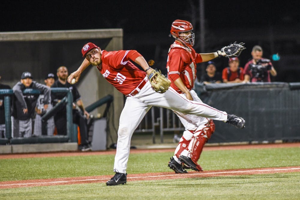 Junior Carl Stajduhar picks up a bunt and launches the ball down to first base Tuesday, March 22, 2017 at Santa Ana Star Field.&nbsp;