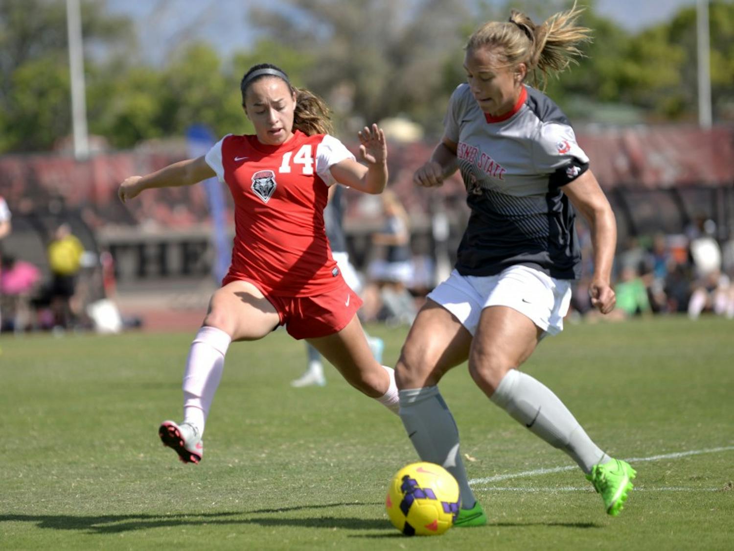 Midfielder Claire Lynch looks to make a play on the ball against Fresno States Fanny Johansson at the UNM Soccer Complex Sunday, Oct. 18, 2015. The Lobos play Colorado College this Friday.