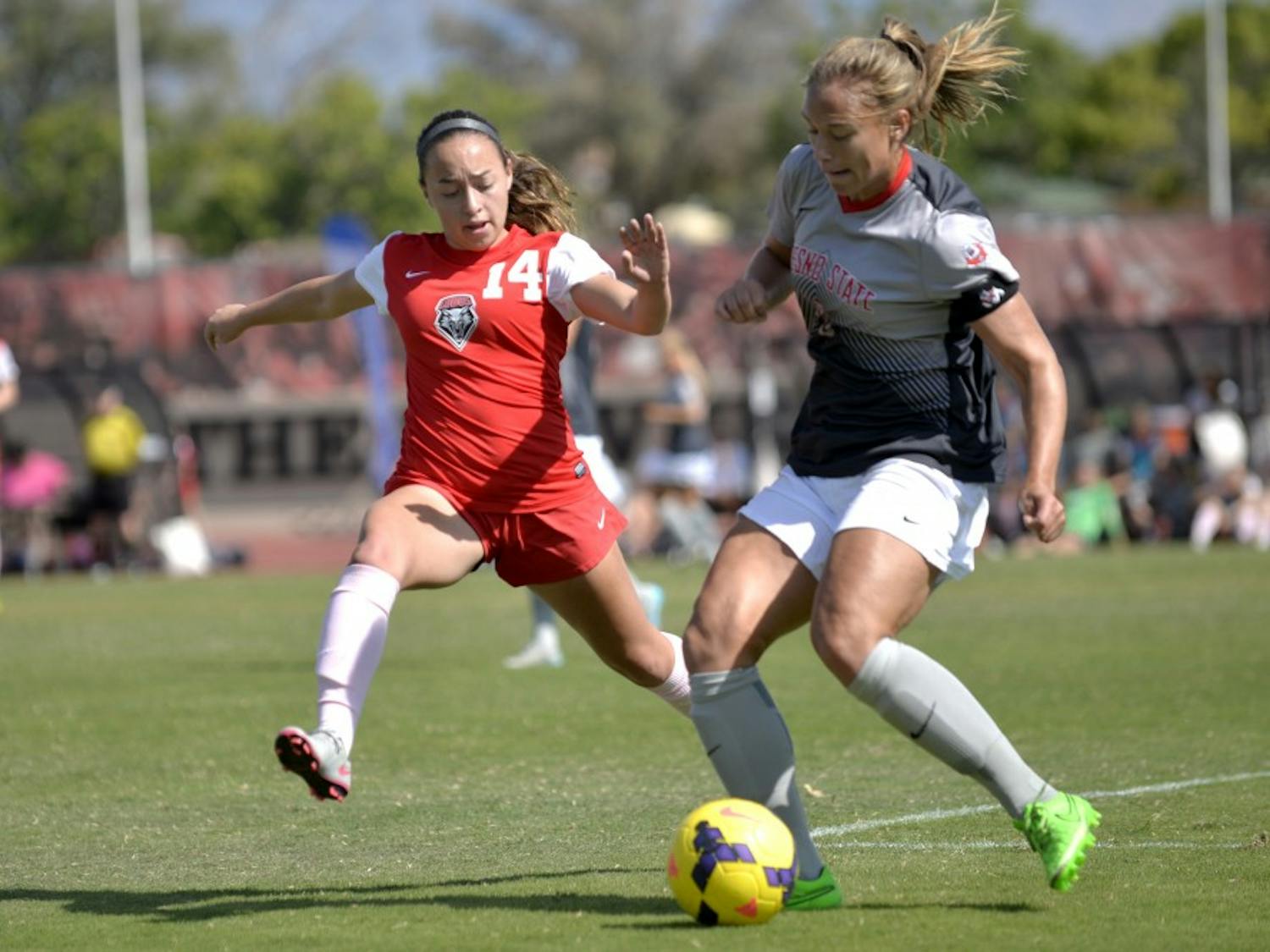Midfielder Claire Lynch looks to make a play on the ball against Fresno States Fanny Johansson at the UNM Soccer Complex Sunday, Oct. 18, 2015. The Lobos play Colorado College this Friday. 