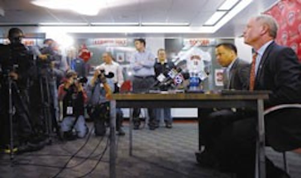 Head men's basketball coach Ritchie McKay, left, and Athletics Director Paul Krebs announce the end of McKay's tenure at a press conference at The Pit on Thursday. McKay has coached the Lobos for the past five years and will finish out the season with the