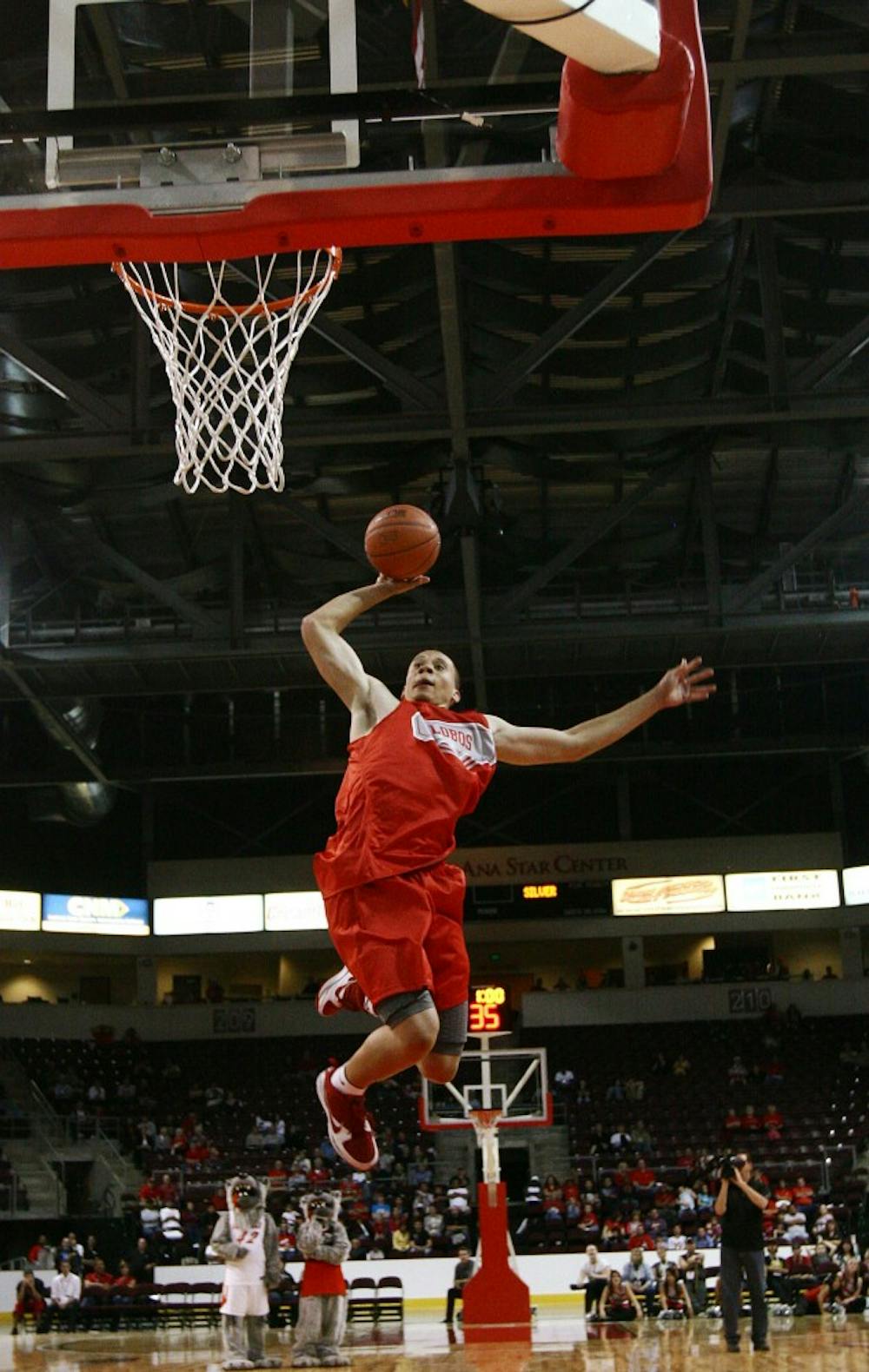 	Swing man Phillip McDonald soars through the air on the way to a one-handed dunk during UNM’s annual Lobo Howl. McDonald won the 3-point contest.