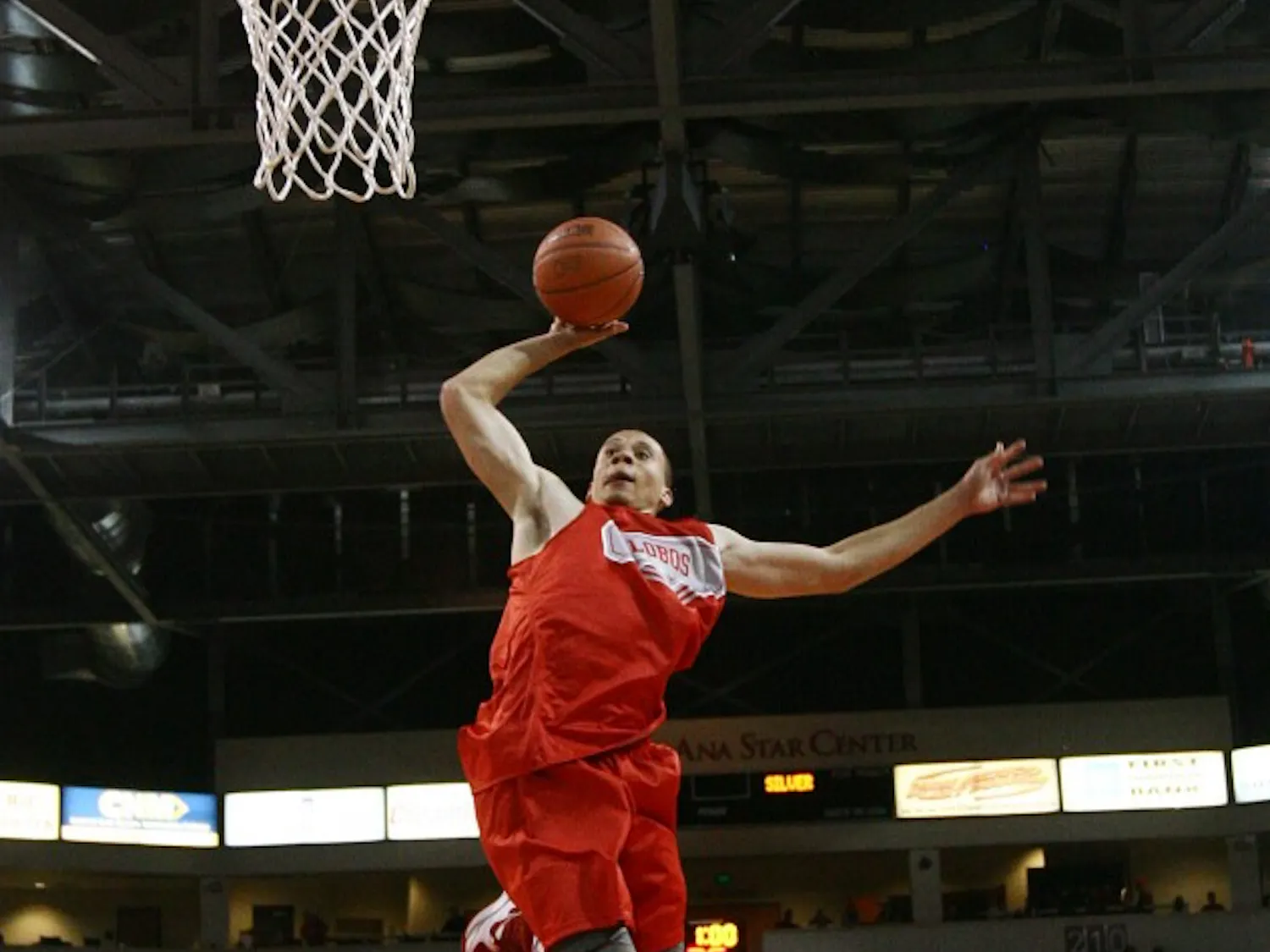 Swing man Phillip McDonald soars through the air on the way to a one-handed dunk during UNM’s annual Lobo Howl. McDonald won the 3-point contest.