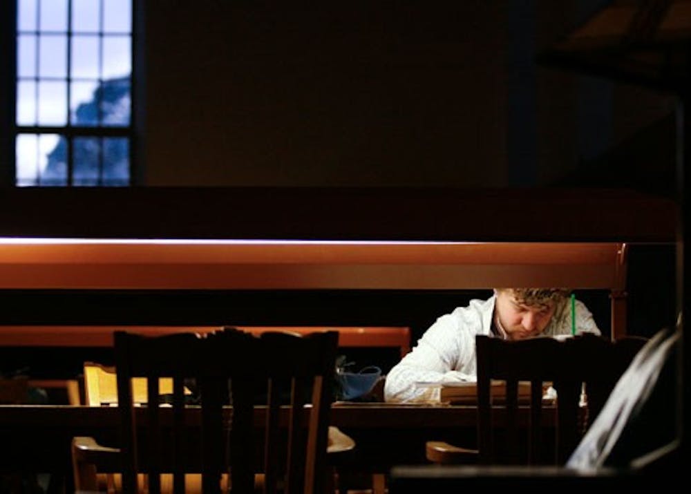 Student Christopher Pendleton studies history at Zimmerman Library on Monday. The University will poll students later this month about library usage and the need for extended hours.