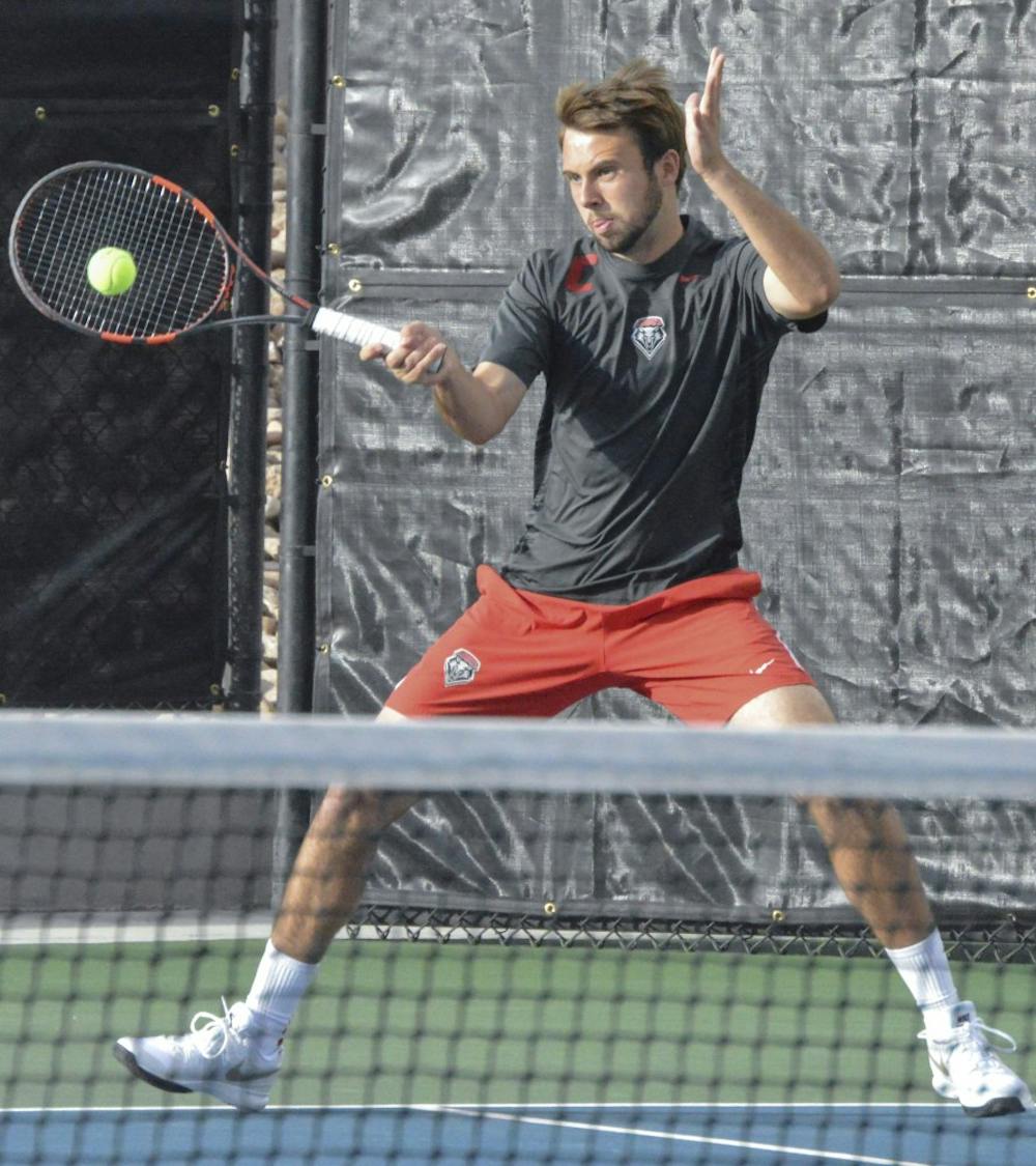 UNM senior James Hignett plays against Air Force Thursday night at the McKinnon Family Tennis Facility. The Lobos defended the Falcons 4-0. 
