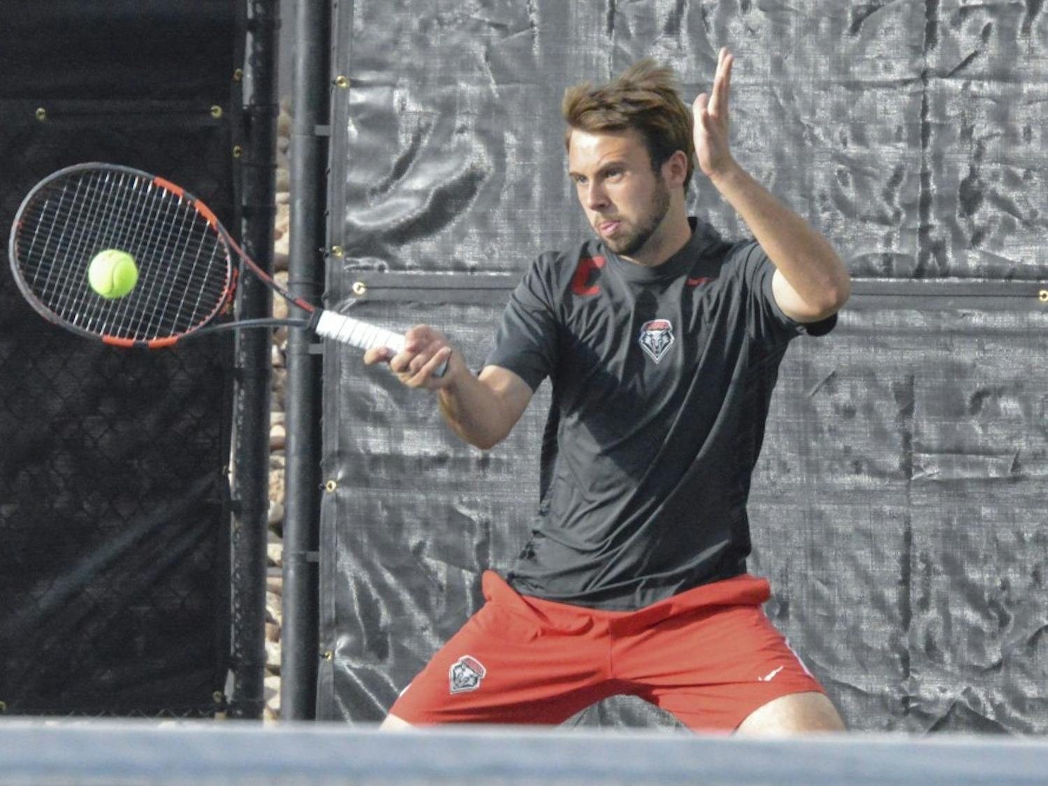 UNM senior James Hignett plays against Air Force Thursday night at the McKinnon Family Tennis Facility. The Lobos defended the Falcons 4-0. 
